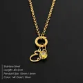 14K vergulde roestvrijstalen ketting met hanger van letter E en gele zirkoniasteen. - Letter E