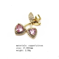 Detail view of cherry pendant charm in copper with pink zircon heart-shaped stone - Style 1
