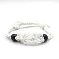 Macro detail of white adjustable woven net pendant cord with decorative black beads - Bracelet / White