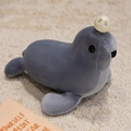 Plush sea lion toy in cool grey with a white hollow ball accessory on soft carpet - Grey Seal Lion / 25cm