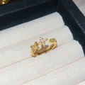Macro detail of 18k gold plated adjustable ring with star flowers and zircon pavé inlay - Gold-Yellow