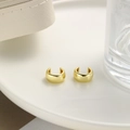 Minimalist gold ear cuff earring displayed on a white ceramic plate with a stylish bag - Gold Smooth Style (ZYN-DME452G)