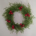 Mini Christmas wreath with green cypress leaves and red berries on white background - Red Green Cypress Leaf Wreath