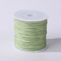 Pale green 0.8mm nylon cord on a white spool for DIY jewelry making and hand weaving - Bright Green