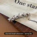 Silver star-shaped spring hair clip with five pentagrams and metallic finish, 8cm long - Silver Star Spring Clip