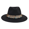 Detail of black fedora hat with woven band featuring starfish and seashell ornaments - Starfish Shell Pendant