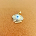 Golden Evil Eye pendant with zircon inlay on orange textured leather background - 35-Gold Big Eyelash Blue White Eye