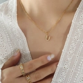 Gold plated titanium steel U-letter necklace with shimmering cubic zirconia pendant - Letter U / Gold