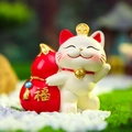 Cute white fortune cat figurine holding a red lucky gourd with gold blessing character - Fortune Gourd Cat