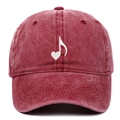 Detailed close-up of retro washed red cotton baseball cap with white heart music embroidery - Burgundy