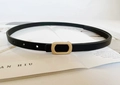 Detail of a thin black belt with a golden pin buckle placed on a fashion magazine - Pearl Gold Short Hollow Buckle / Black