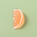 Macro detail of resin orange slice pendant with realistic texture and metal ring - Semi-circle Slice / Orange