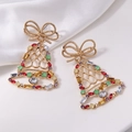 Detailed macro view of Christmas bell earrings with colorful rhinestones and gold plating - Bell Studs