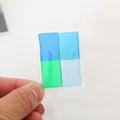 Detail of colorful dollhouse paper cards in transparent packaging for 1:12 miniature scenes - Blue