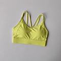 Fluorescent lime green high-impact sports bra with cross-back thin straps in flat lay - S / Tops / Fluorescent Green
