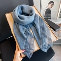Blue linen lace scarf with delicate floral trim displayed on a gold tray - Blue