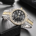 Macro shot of luxury gold and silver quartz watch with crystal-encrusted bezel on gift box - Two-tone Black Dial