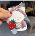 Pink braided bow hair tie featuring a cute strawberry charm and a checkered block ornament - Pink Strawberry Decoration