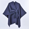 Detail of navy blue wool shawl cape featuring a stylish bow-knot tie and subtle fringe edges - Solid Color Tassel Tie / Navy Blue