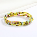 Close-up of colorful handmade beaded body chain with vibrant yellow and pink glass beads - Yellow Pink Blue