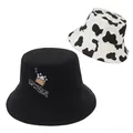 Cotton bucket hat set with black cowgirl embroidery and stylish cow print pattern - Black Cow Embroidery And Cow Print