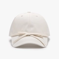 Creamy white baseball cap featuring a delicate bow tie decoration on the front - Beige / Adjustable
