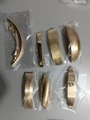 Golden alloy geometric hair clip set with seven textured rectangular and curved designs - Set 1 (7 Pieces)