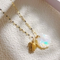 Golden necklace with detailed sea turtle pendant and iridescent shell on a flat link chain - Sea Turtle