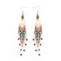 Macro detail of Bohemian long beaded fringe earrings with colorful ethnic patterns - Ethnic Striped Tassel