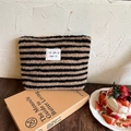 Plush makeup bag with black and brown stripes, soft faux shearling texture for travel - Black & Brown Striped