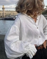 Detail of white linen shirt with elegant lantern sleeves and ruffled cuffs in outdoor setting - S / White