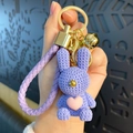 Cute purple resin rabbit keychain with heart detail and matching braided wrist strap - Purple