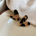Close-up of heart-shaped leopard print earrings with gold metal edges on a ceramic plate - 16# Leopard Heart Gold Border Studs (Silver Pin-Gold-Coffee-Heart)