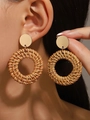 Macro detail of handmade bohemian woven rattan hoop earrings with gold metal disc - Coffee Metal Disc Rattan Round Style (9947)