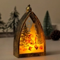 Detail of vintage Christmas lantern featuring Santa illustration and warm LED light glow - Bronze Santa Claus