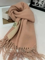 Detail of soft pink and beige cashmere-feel scarf showing fringes and high-quality texture - Pink