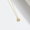 Elegant gold necklace featuring a minimalist compass pendant with a starburst center - Eight-Pointed Star/Compass / Gold