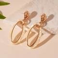 Elegant gold oval earrings with beige marble resin hoops on white stone display - White Oval Drop