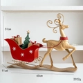 Golden iron reindeer with red Christmas sleigh decor, includes dimensions and weight detail - Gold Red Reindeer Pulling Sleigh