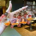 Set van vier schattige Capybara vloeibare zand sleutelhangers in oranje met siliconen band - TV Stijl (Willekeurige Kleur)