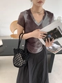 Detail of coffee gray tie-dye V-neck T-shirt paired with a black woven bucket bag - Black (with inner bag)