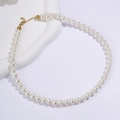 Elegant titanium steel necklace featuring white round pearls and a golden lobster clasp - 8mm Round Bead Style