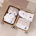 Minimalist pearl white travel storage bag set inside luggage for clothing organization - White 7-Piece Set