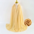 Elegant yellow bubble chiffon scarf wrap for women shown on a fashion model - Yellow