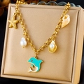 Golden chunky chain bracelet with enamel dolphin and shell ocean charms on velvet - Enamel Dolphin Pearl Shell Style (N3133)