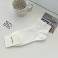 Chaussettes courtes en coton blanc avec texture côtelée et étiquette de marque - Taille unique / Blanc