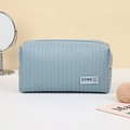 Light blue PU leather makeup bag with vertical dotted texture and zipper closure - Makeup Tool Storage Bag (208) / Blue