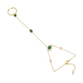 Gold slave bracelet with emerald green stones and white zircons on a white background - Oval Style