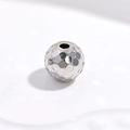 Macro shot of S925 sterling silver hammered texture sphere beads for jewelry DIY - White Gold 6mm Honeycomb Bead
