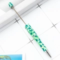 DIY plastic beaded pen featuring a green camouflage print and silver metal accents - Green Camouflage Retractable (103)